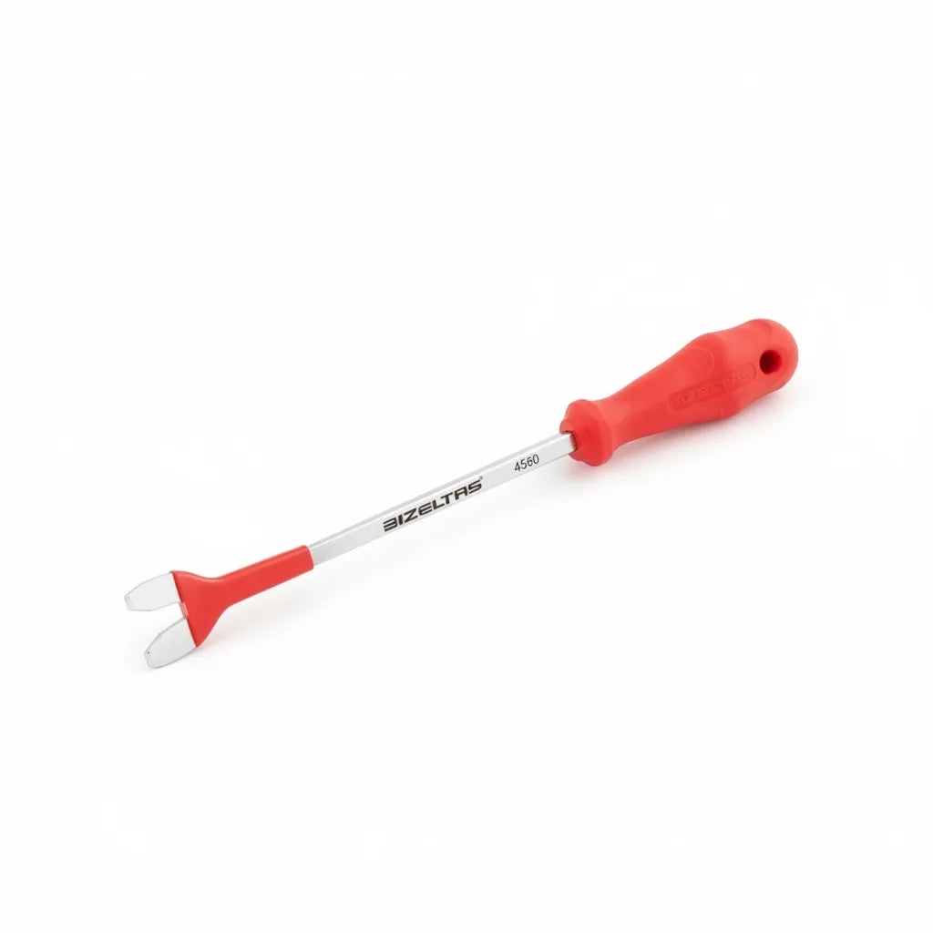 Close-up of the panel removal tool extracting a plastic fastener