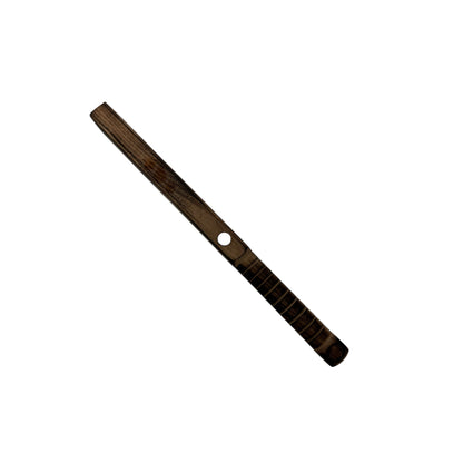 Close-up of the magnetic base on the wooden slap tool