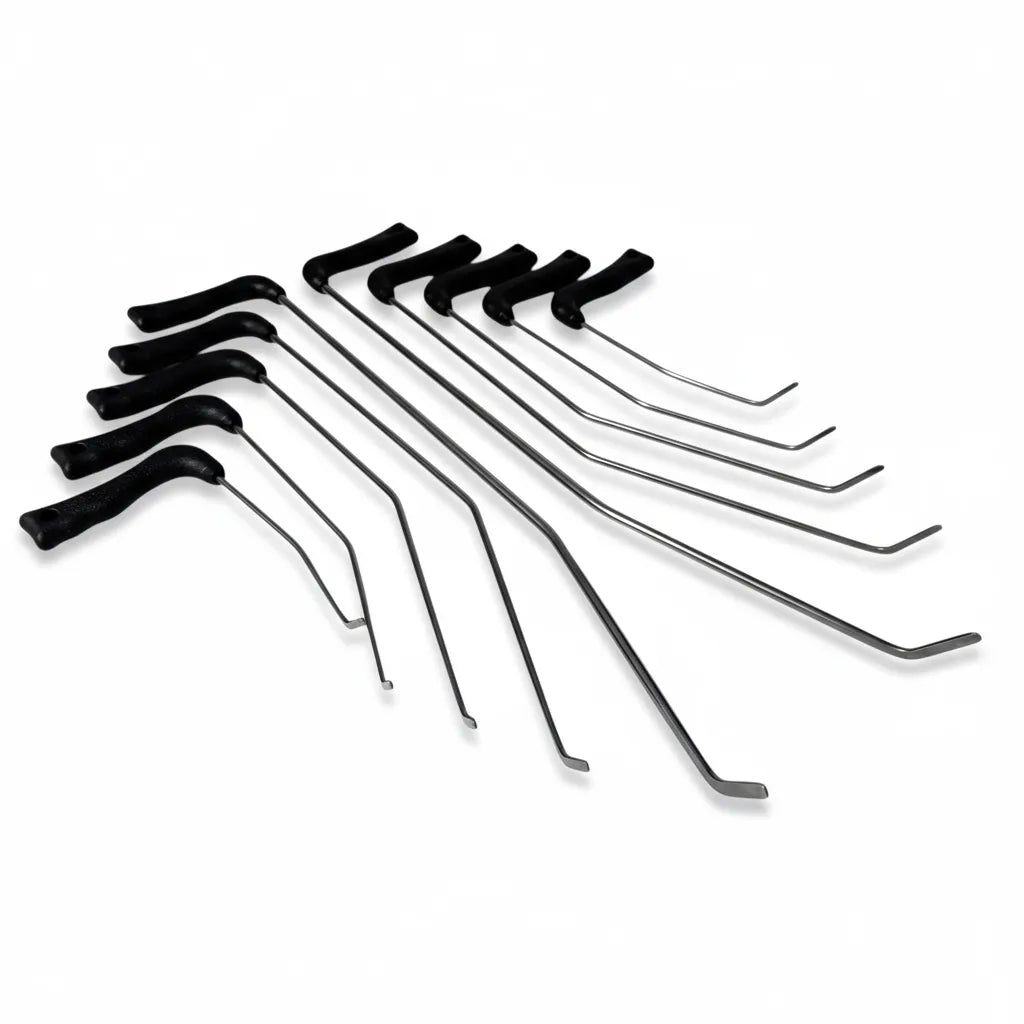 Auto body technician selecting a white spring steel PDR rod