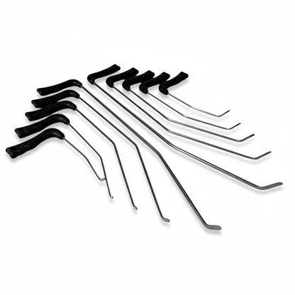 Auto body technician selecting a white spring steel PDR rod