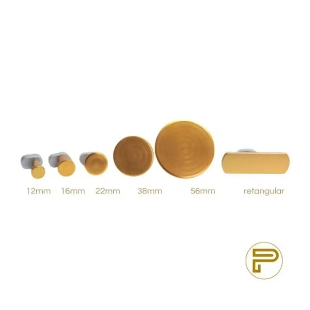 Close-up of round and rectangular PDR cold glue tabs