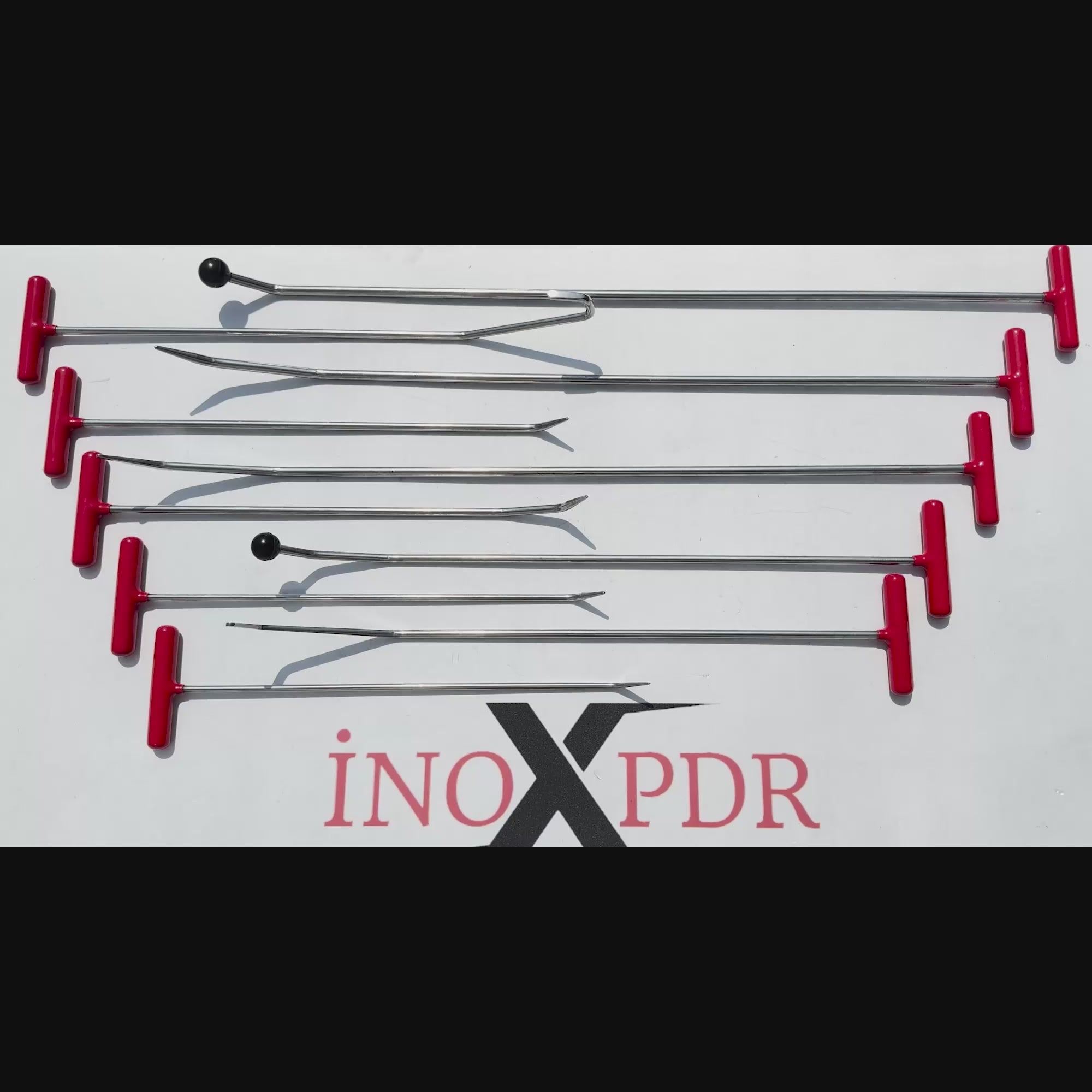 PDR INOX versatile dent repair rod used on a car panel
