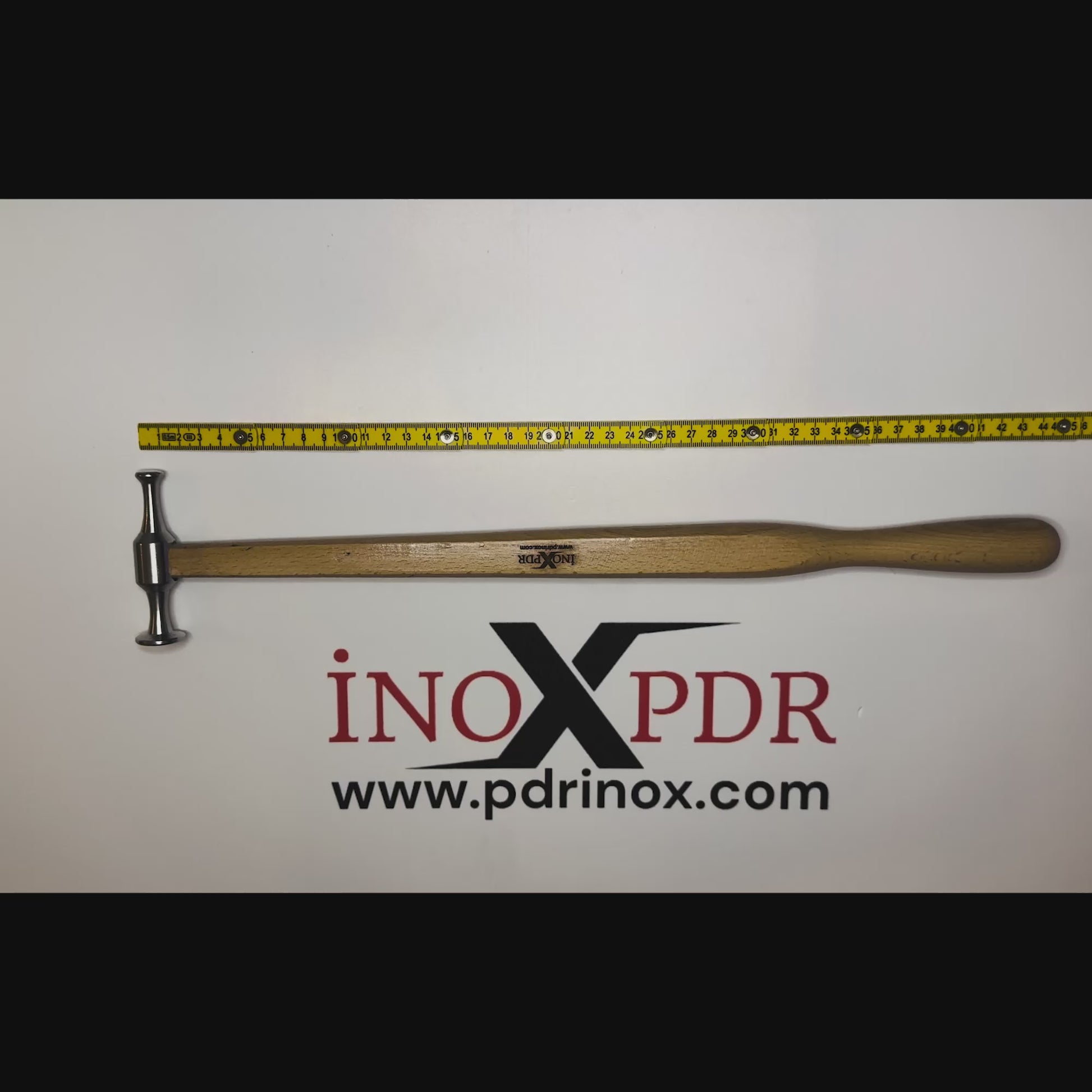 Technician blending a dent with the ergonomic PDR INOX hammer