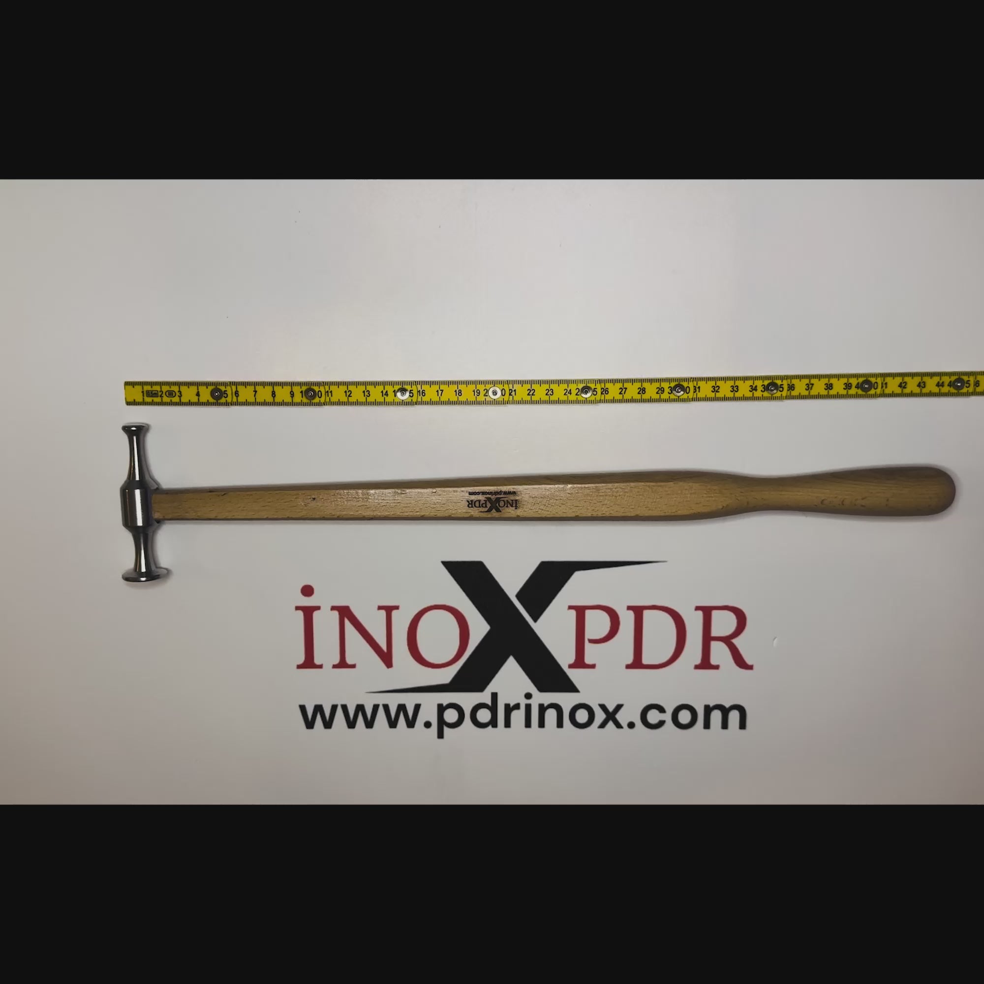Technician blending a dent with the ergonomic PDR INOX hammer