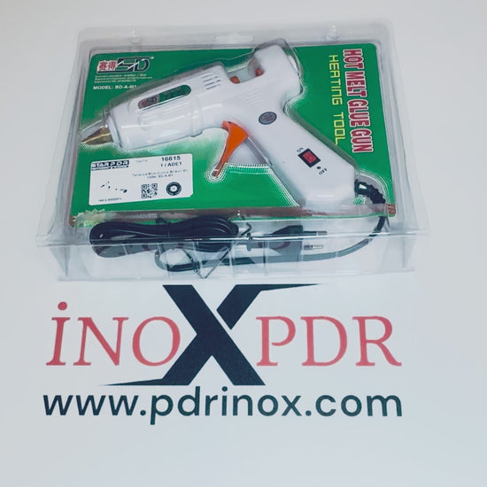 Close-up of the precision nozzle applying hot glue to a PDR tab
