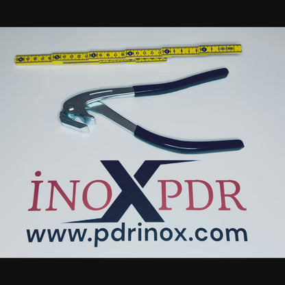 PDR technician using the edge pliers to straighten a car fender