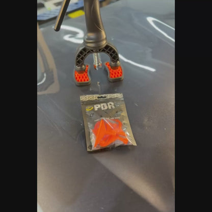 PDR INOX assorted crease tab applied to a vehicle body line