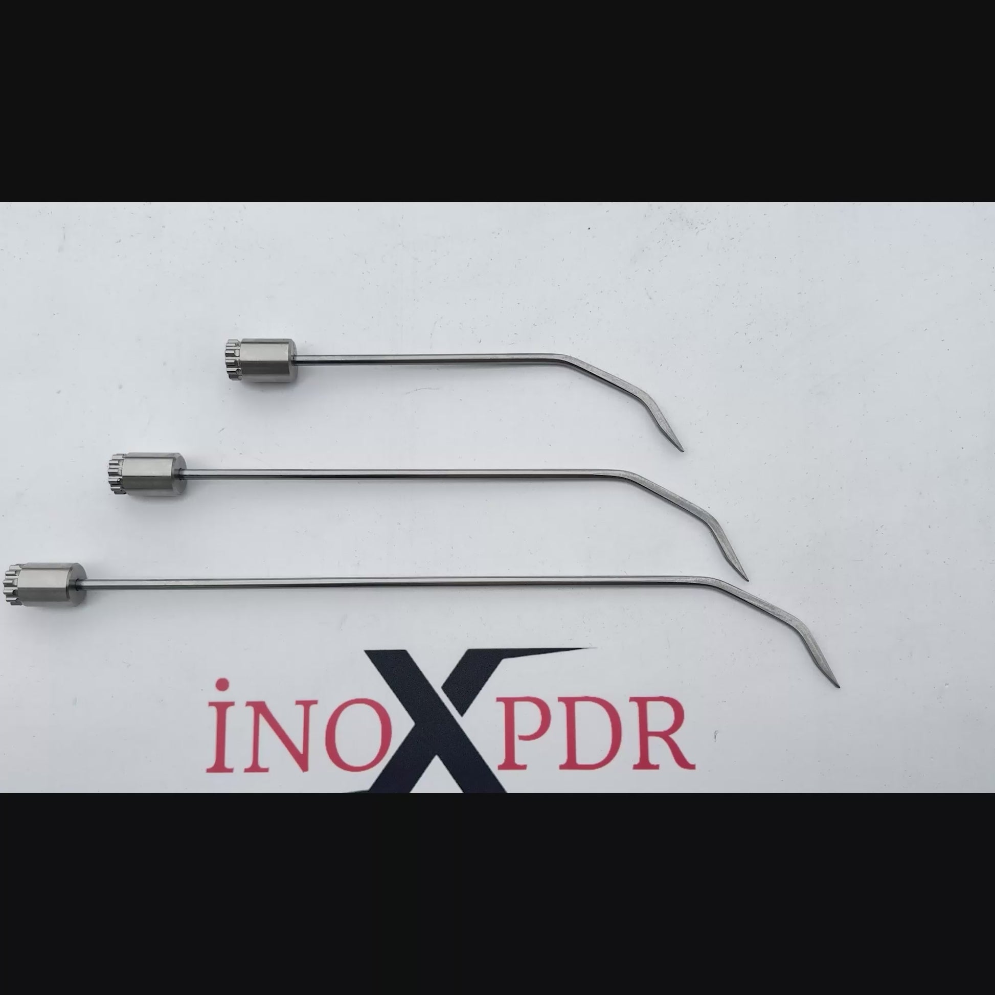Auto body technician utilizing the rotatable Milano PDR tool