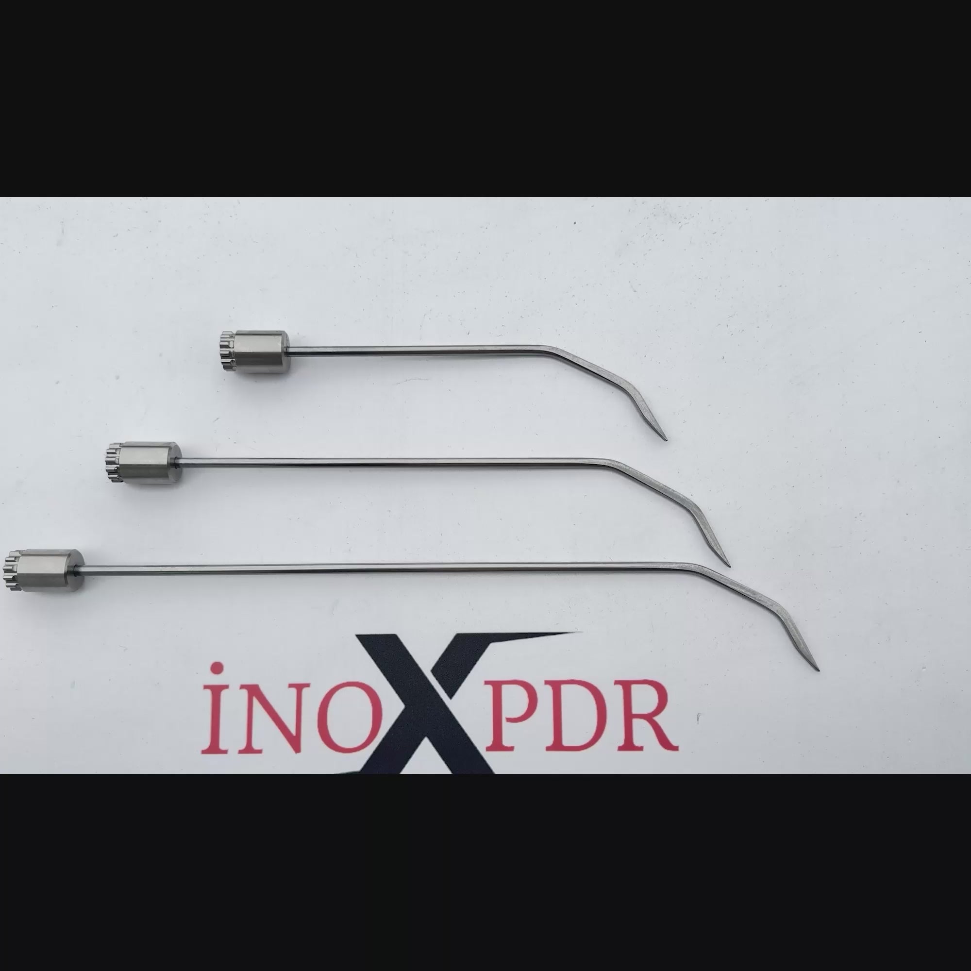 Auto body technician utilizing the rotatable Milano PDR tool